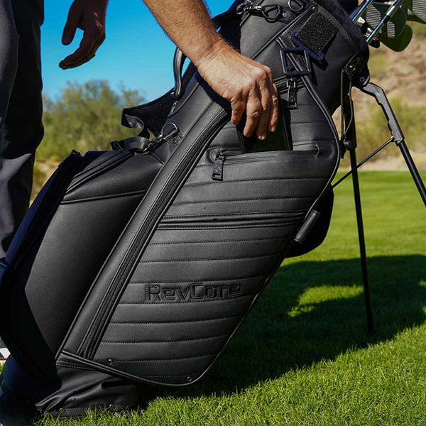 Black golf bag with 'RevLope' branding on a golf course