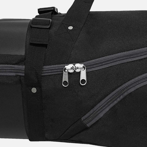 Close-up of a black bag with zippers and straps on a white background
