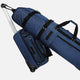 Blue rolling suitcase with a golf bag on top against a white background