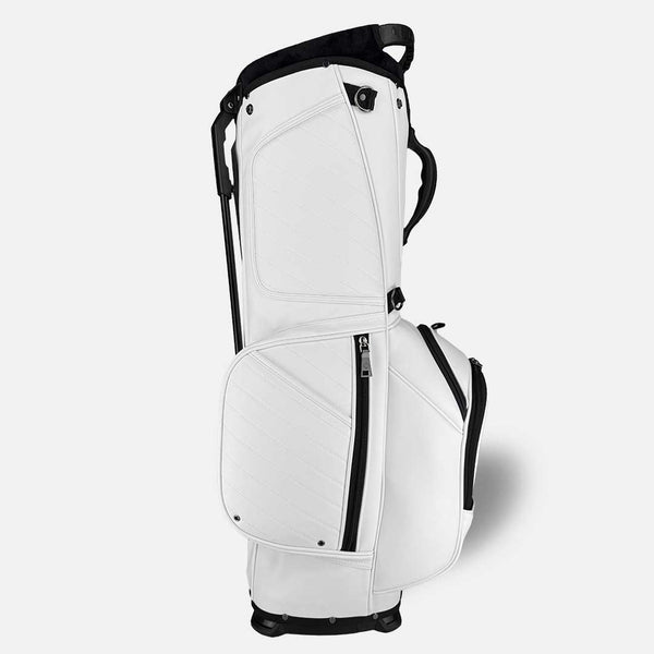 White golf bag with black accents on a light gray background