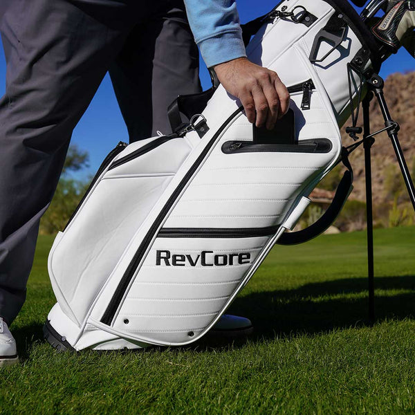 White golf bag with 'RevCore' branding on a golf course