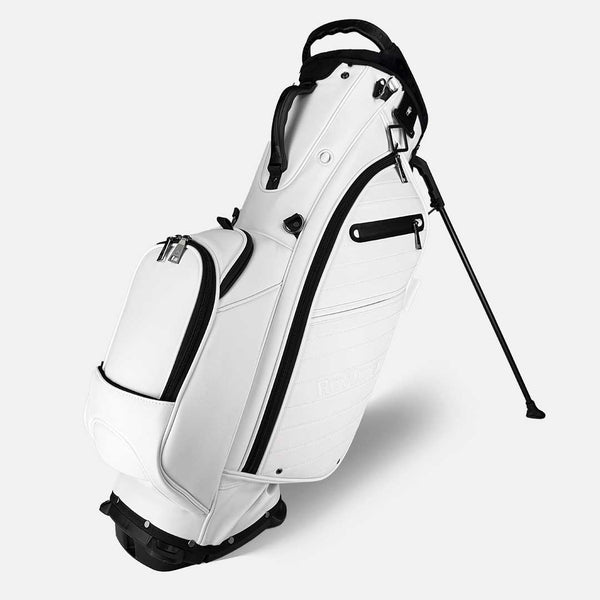 White golf bag with black accents on a light gray background